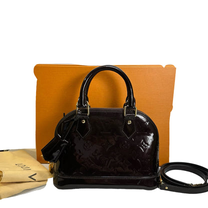 Used LOUIS VUITTON Patent Alma Cross body bag Amarante