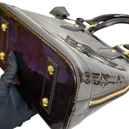 Used LOUIS VUITTON Patent Alma Cross body bag Amarante