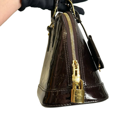 Used LOUIS VUITTON Patent Alma Cross body bag Amarante