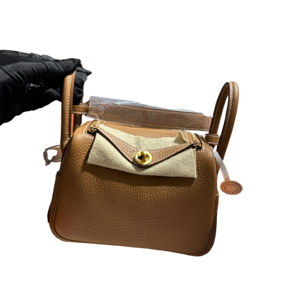Brand New HERMES Clemence Lindy Handbag Gold